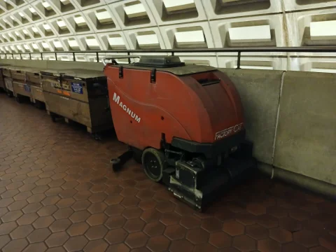 Ride-on industrial floor scrubber machine